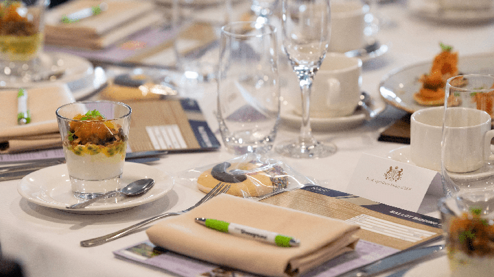 Wine flutes, glasses, and teacups, with yoghurt and salmon canapes served at a RASF Charity Brunch event.