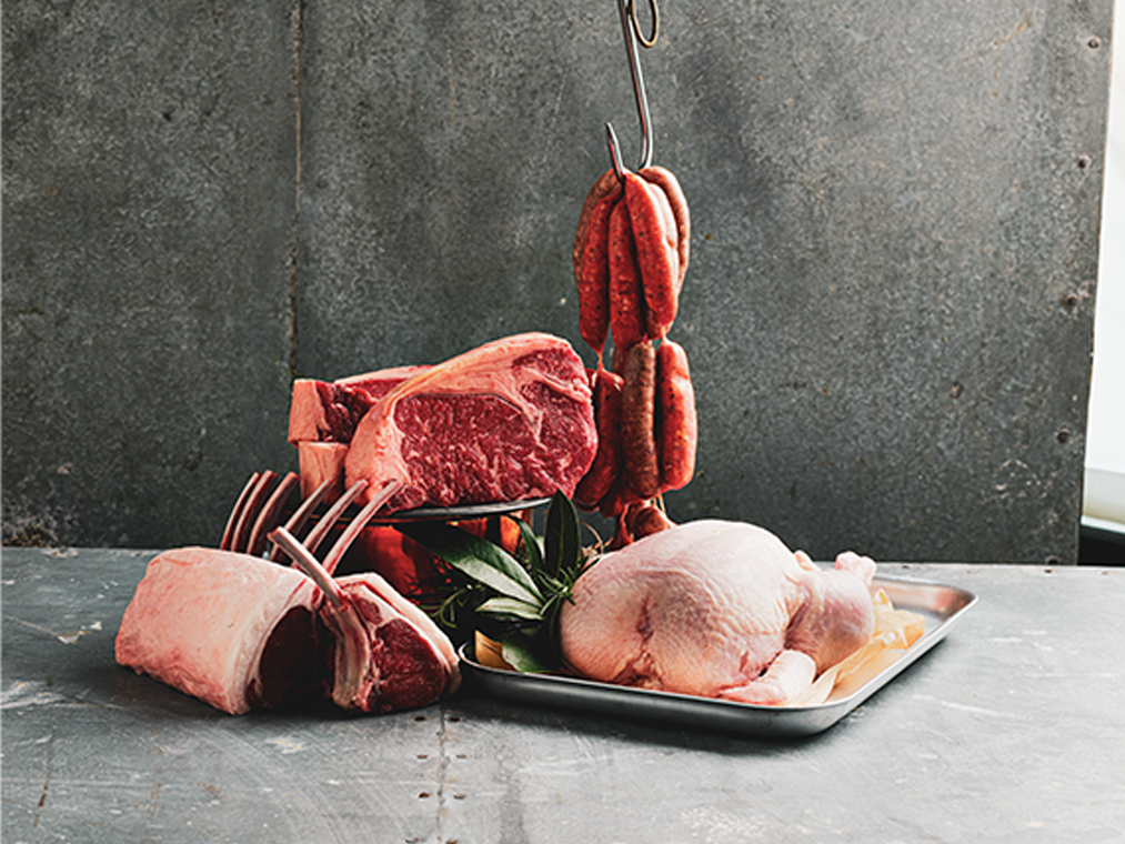 Display of raw beef, lamb, sausages, and chicken at the Sydney Royal Branded Meat Competition.