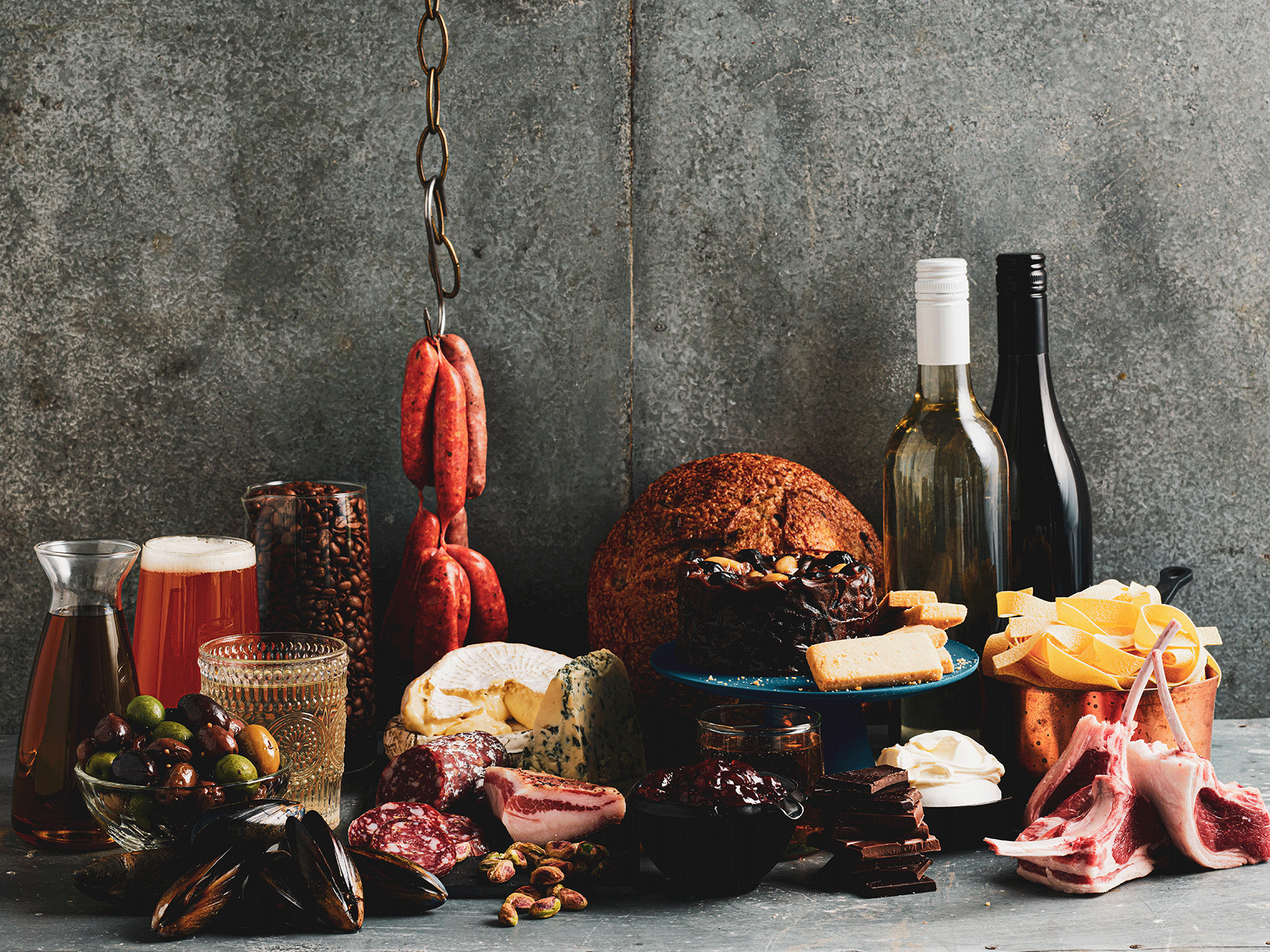 Charcuterie display of gourmet food and drinks including wine, cheese, coffee, olives and bread for the Annual President's Medal Competition.