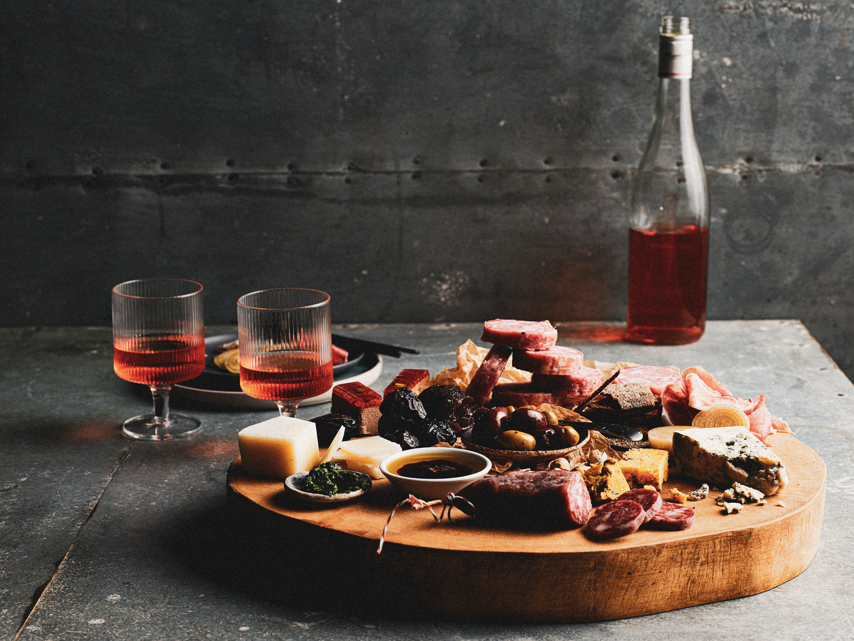 Wooden platter with cured meats, cheese, and olives at the Sydney Royal Fine Food Show Smallgoods & Charcuterie Competition.