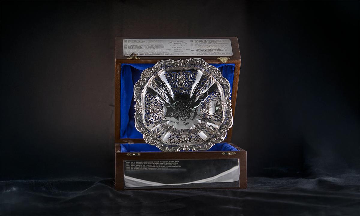 Victorian sterling silver fruit bowl with pierced and embossed decoration and an engraved crest. First awarded in 1986.