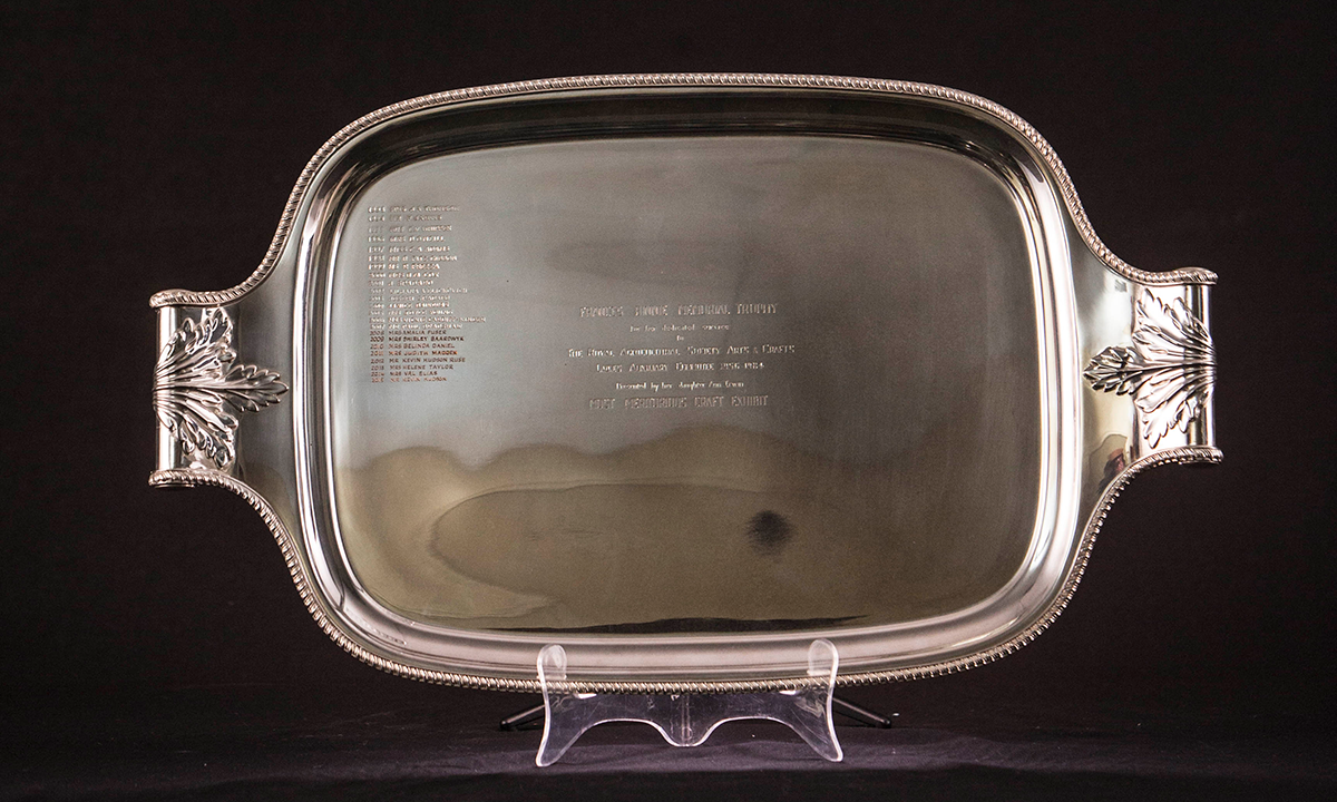 Silver twin handled tray of rectangular form with foliate embossed handles and detailed border, inscribed: 