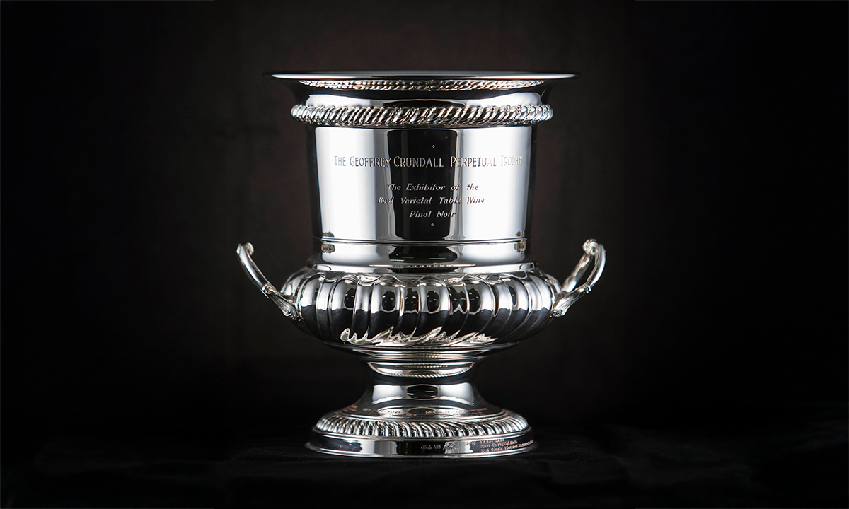 Silver cup with twin handles and decorative edges. Engraving on the body of the trophy reads: “The Geoffrey Crundall Perpetual Trophy”. First presented in 1995. 