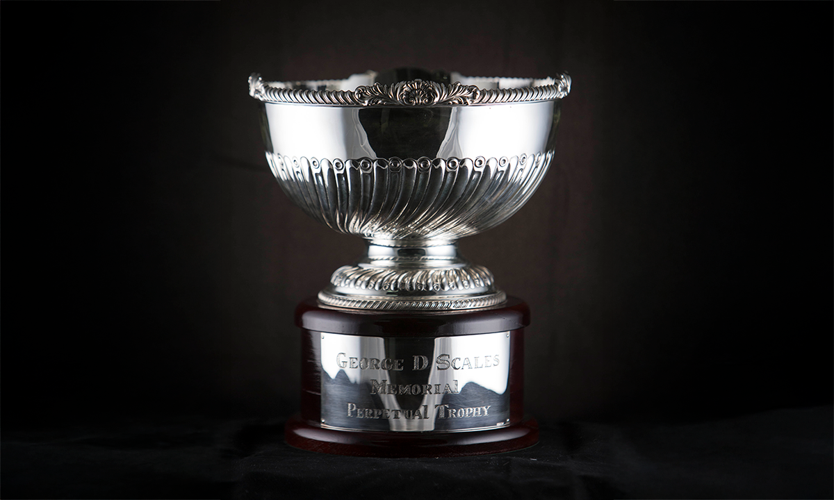 Silver bowl with swirling design on bottom half of body, foot, and rim, raised on a circular base. First awarded in 2011. 