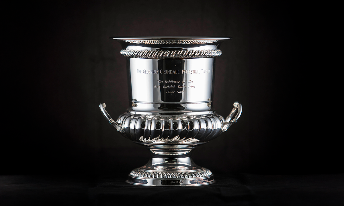 Twin handled silver cup mounted on a black round base. First presented in 1947.