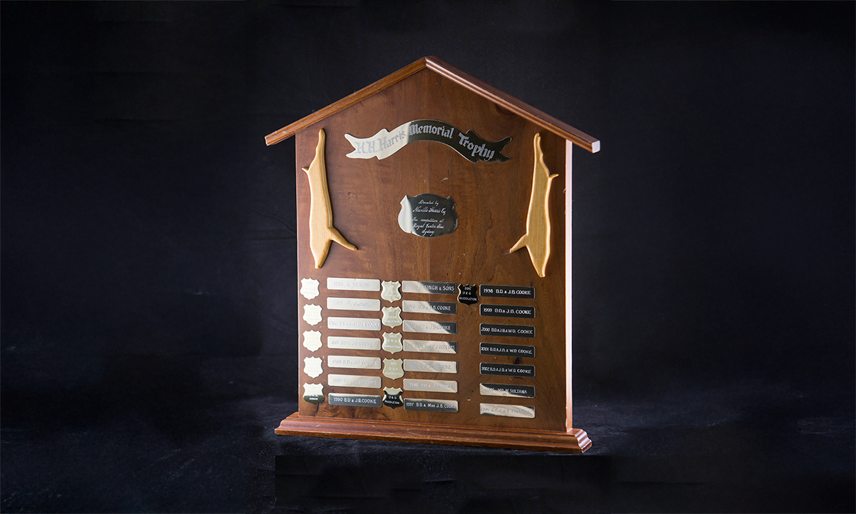 A walnut shield with brass plaques of pig carcasses. First awarded in 1979.