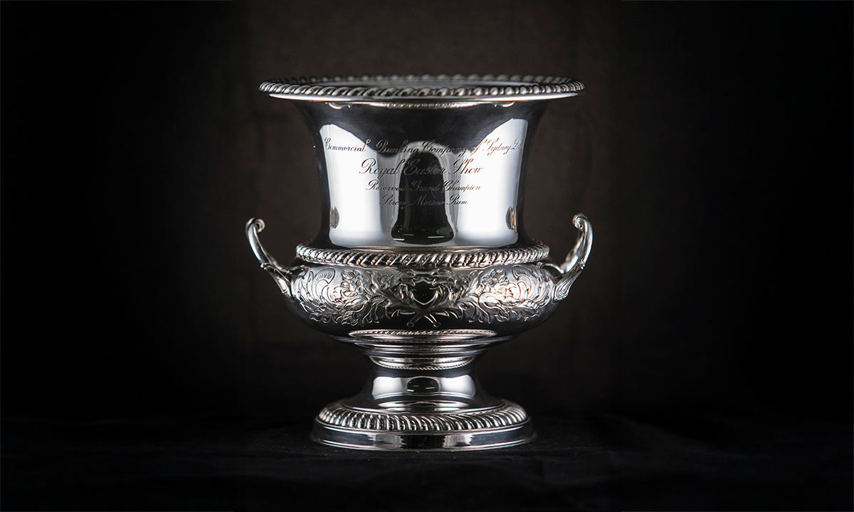 Silver wine cooler with two handles and engraved floral and foliate decoration. First awarded in 1961.