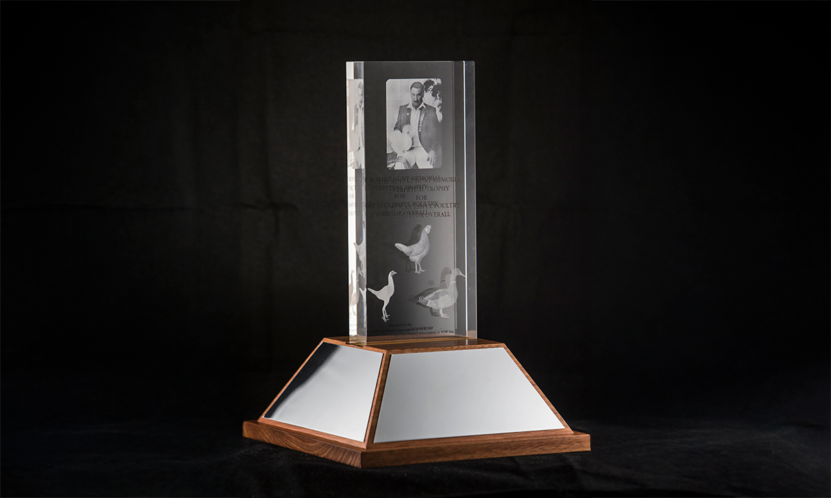 Etched crystal with poultry and picture of Robert Hunt on sloped hardwood plinth. First presented in 2015.