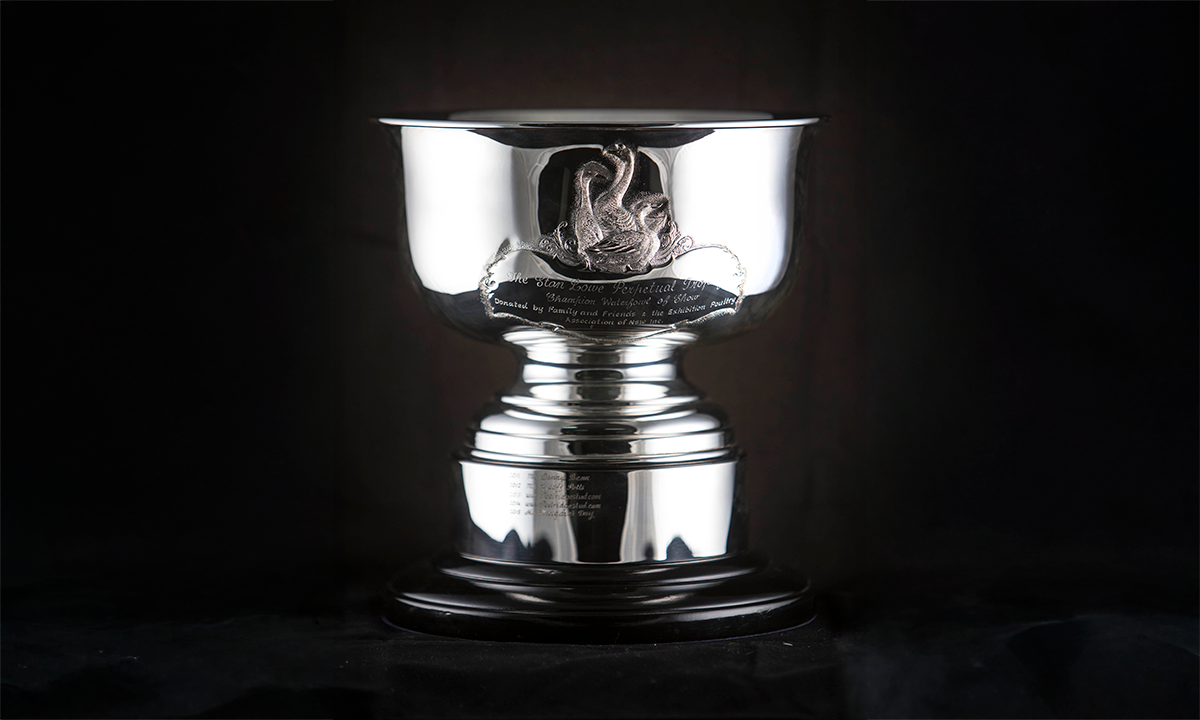 Silver trophy cup with hand-chased waterfowl in the centre and mounted to circular base. First presented in 2011. 